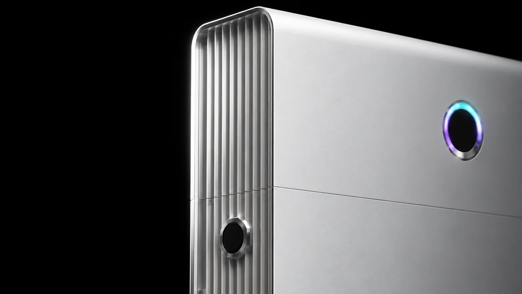 Close-up of a Sigenergy SigenStor showing the ribbed aluminium heatsink spine, an octagonal connector and the circular status display Close-up of a Sigenergy SigenStor showing the ribbed aluminium heatsink spine, an octagonal connector and the circular status display