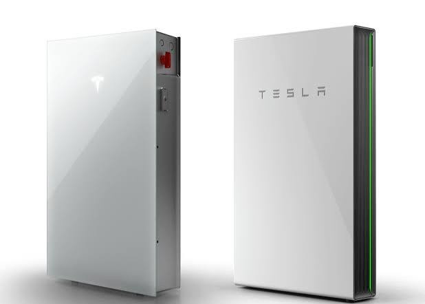 Tesla Powerwall 3 and Powerwall 2 home batteries Tesla Powerwall 3 and Powerwall 2 home batteries mounted side by side