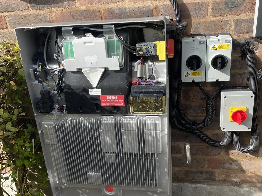 A Tesla Powerwall 3 with its cover removed during installation, showing the Gateway, isolators and DC wiring A Tesla Powerwall 3 with its cover removed during installation, showing the Gateway, isolators and DC wiring