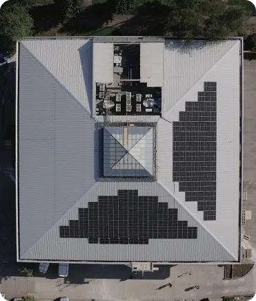 Aerial view of a commercial rooftop solar installation